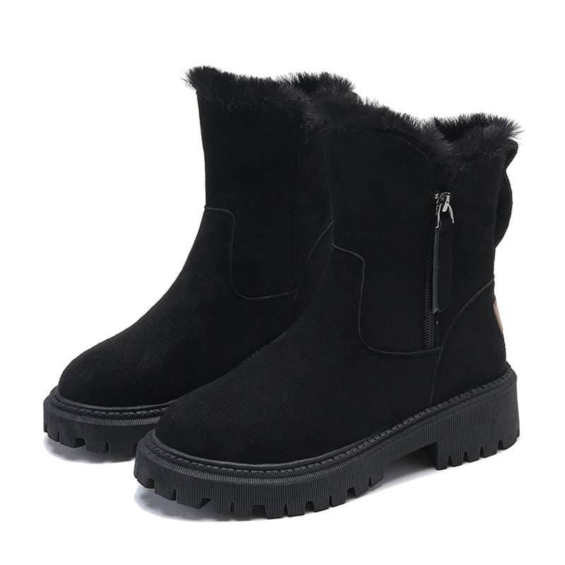 Black side-zip boots with fluffy upper edges on a white background.