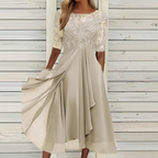 Cream-beige dress with a lace bodice and softly draped skirt.