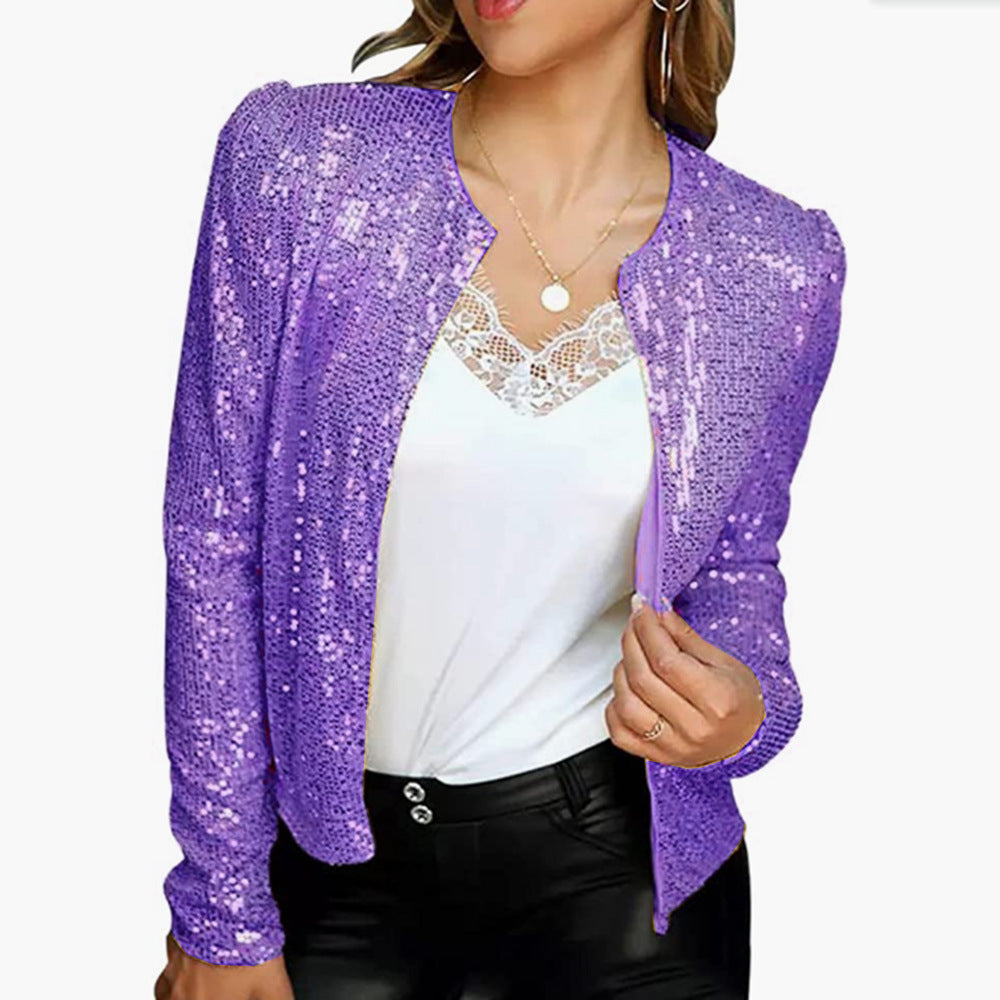 Purple sequin blazer worn over a white top.