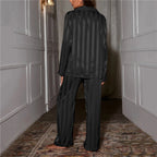 Back view of the black striped satin pyjama set.