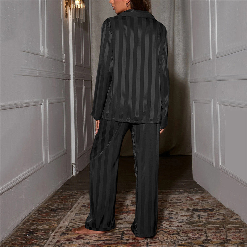 Back view of the black striped satin pyjama set.