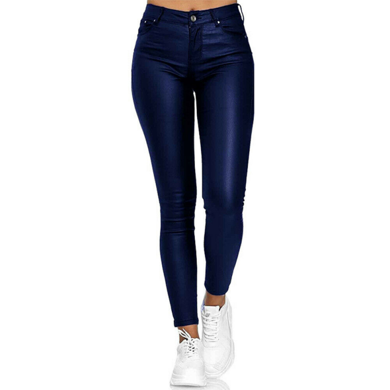 Blue skinny jeggings viewed from the front with trainers.