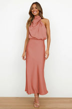 Coral-coloured midi dress with a softly flared hem.