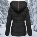 Back view of a black quilted jacket with its hood zipped closed.