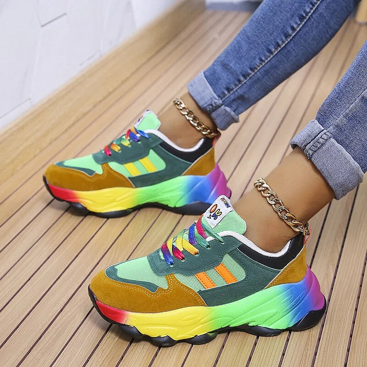 Green colourblock sneakers with side stripes and chunky rainbow soles.