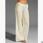 Cream wide-leg trousers with a drawstring waist.