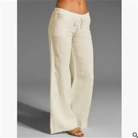 Cream wide-leg trousers with a drawstring waist.