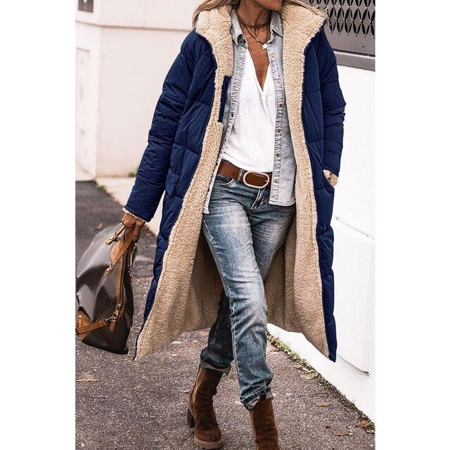 Navy blue long quilted jacket with a pale textured inside.