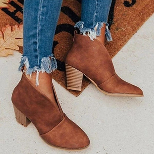 Brown ankle boots with a V-notched front and layered-look block heels.