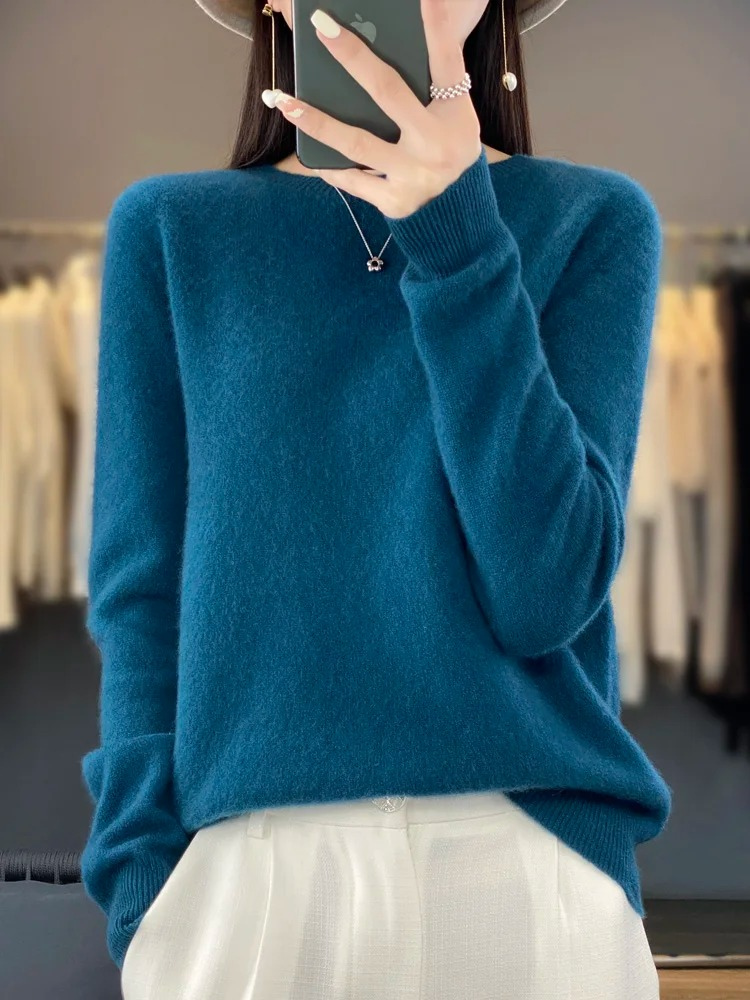 Dark blue jumper with long sleeves and a softly textured surface.