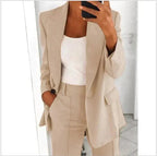 Beige jacket and matching trousers, shown in a close view.