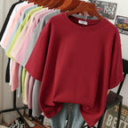 Wine-red T-shirt with dropped shoulders displayed on a hanger.