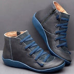 Blue-trimmed ankle boots with lace-up fronts and visible light-coloured lining.