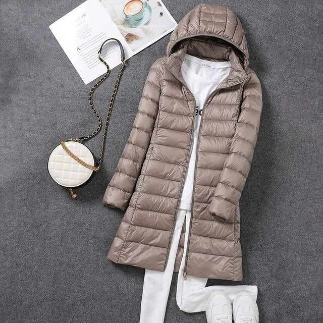 Khaki puffer coat with horizontal quilting.