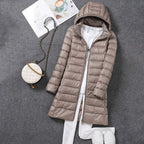 Khaki puffer coat with horizontal quilting.