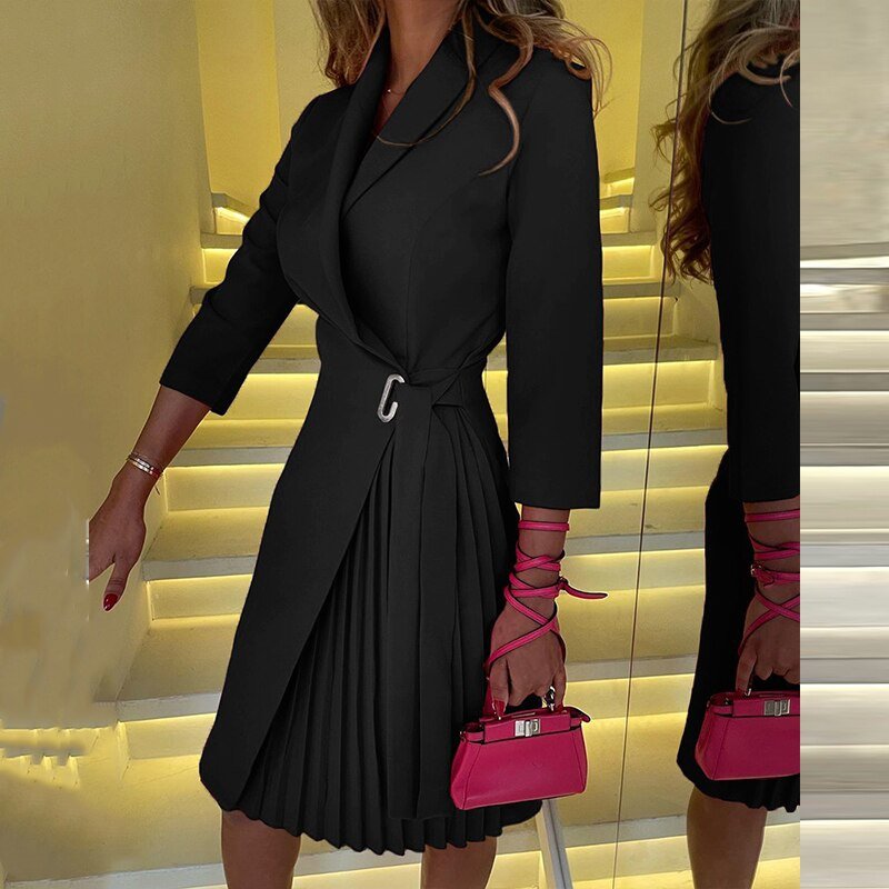 Solid black blazer dress with a pleated skirt panel and side waist detail.
