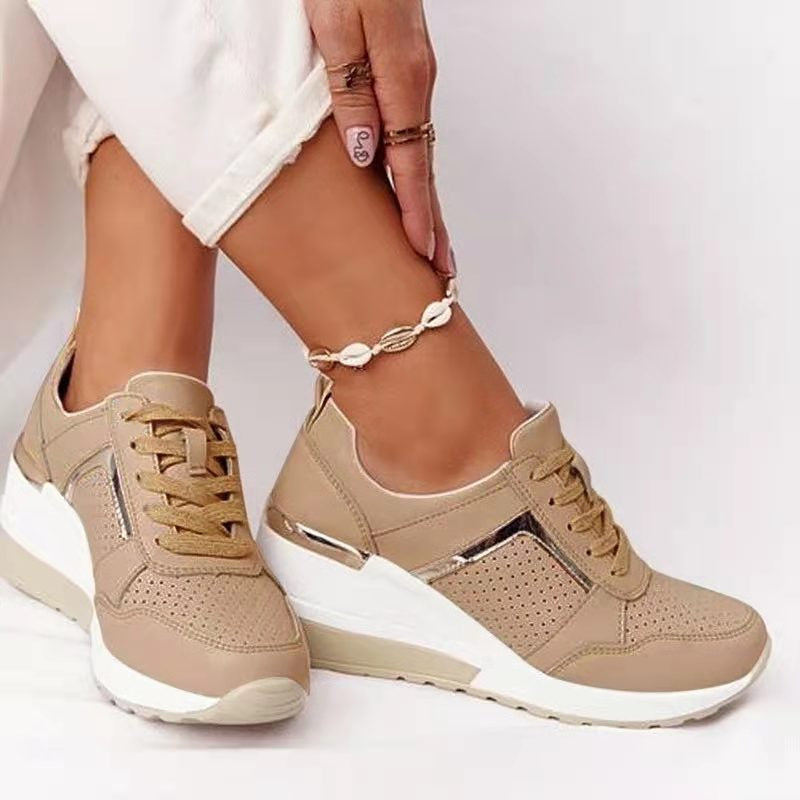 Khaki trainers with matching laces and metallic accents.