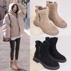 Dazzle boots in apricot and black beside a winter outfit.