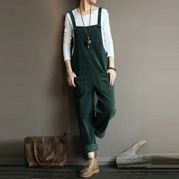 Green corduroy dungarees with front patch pockets and loose legs.