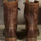 Back view of dark brown boots with stitched vertical panels.