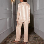 Back view of the beige striped satin pyjama set.