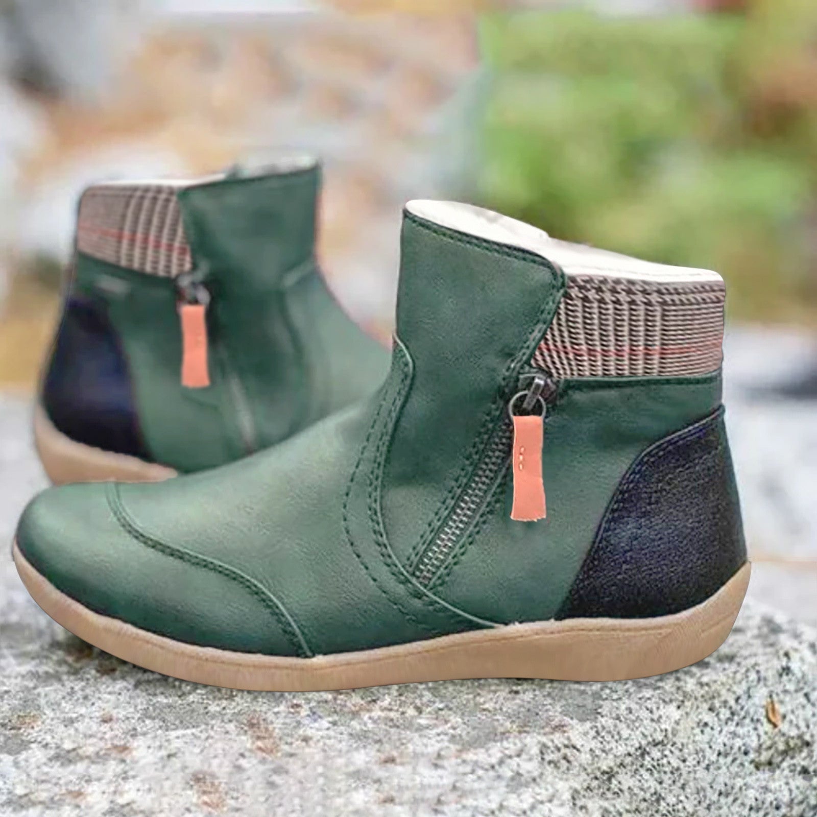Green ankle boots with checked collars, side zips, dark heel panels and tan soles.