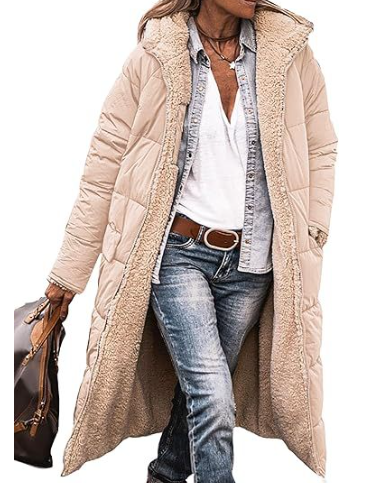Beige long coat worn open with a cream teddy lining.
