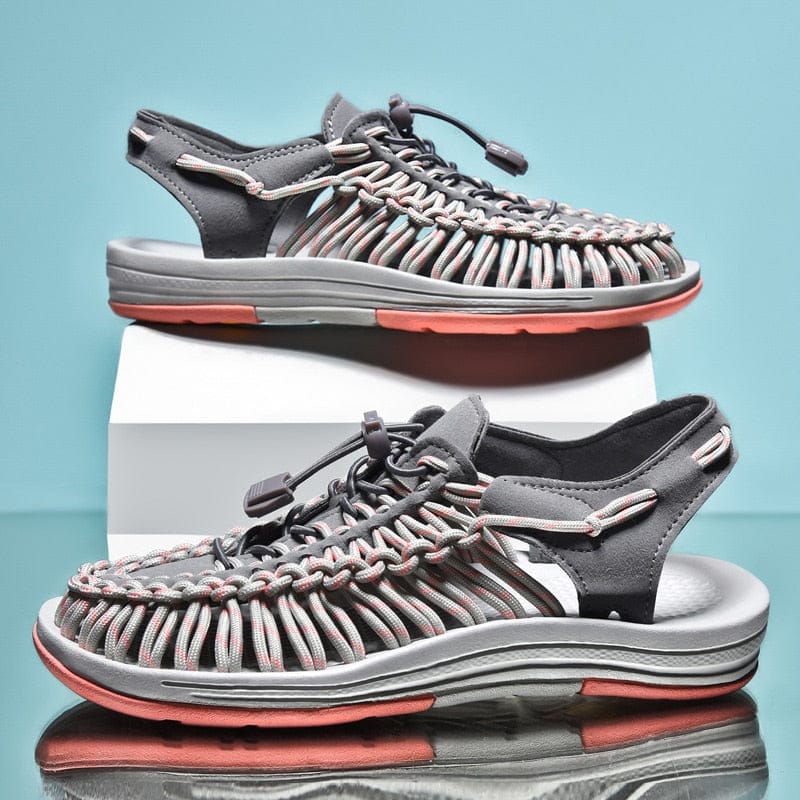 Grey and pink cord sandals with open sides and layered grey soles.