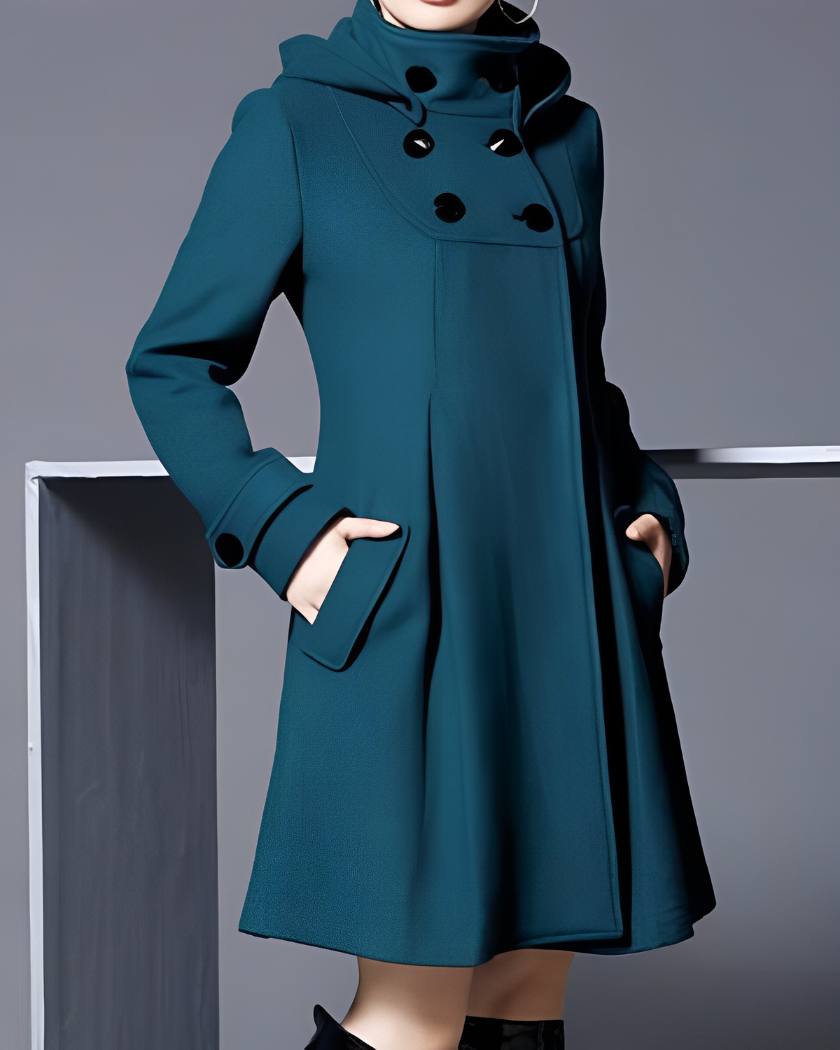 Teal-toned coat with a high buttoned neckline and slanted side pockets.