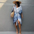 White-and-blue printed cover-up tied at the waist.