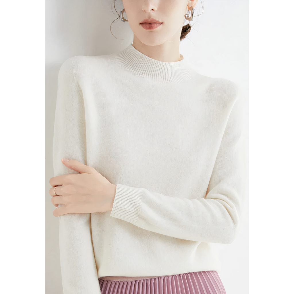 White jumper with ribbed cuffs and a close short collar.
