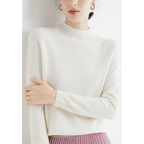 White jumper with ribbed cuffs and a close short collar.