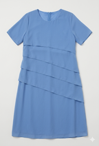 Light blue dress laid flat with diagonal layers and short sleeves.
