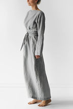 Grey long-sleeve dress with a tied waist, shown from the side.