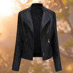 Black leather-look jacket with laced shoulder details and diagonal zip pockets.