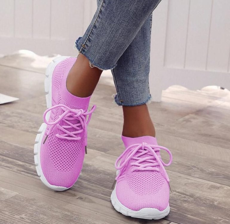 Purple trainers with laces and contrasting white soles.