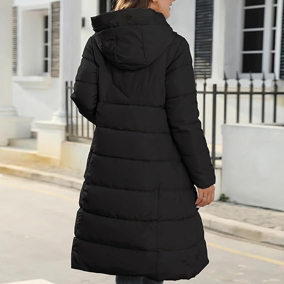 Back of the black coat showing its hood and horizontal quilted sections.