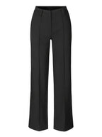 Black trousers laid out to show front seams and belt loops.