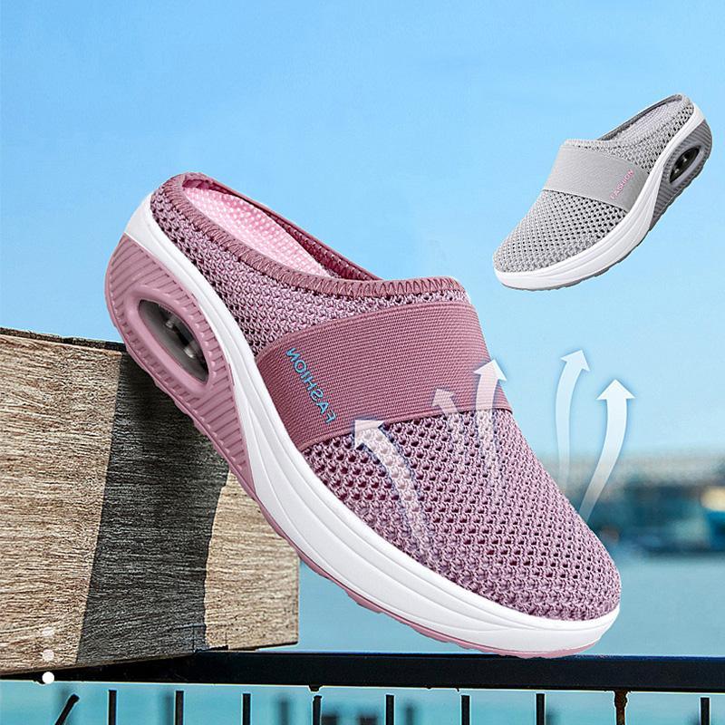 Pink mesh mule beside a grey shoe, with upward arrows added to the photograph.