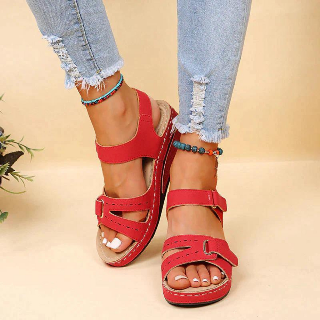 Red slingback sandals viewed from above.