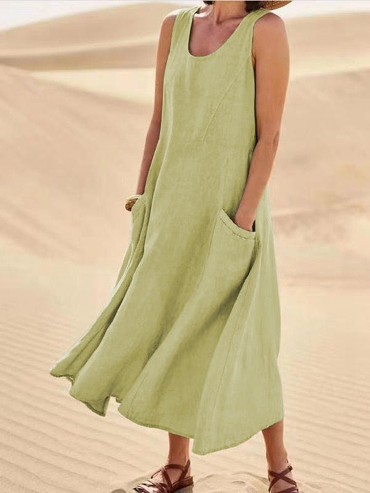 Light green sleeveless dress with a rounded neckline and large pockets.