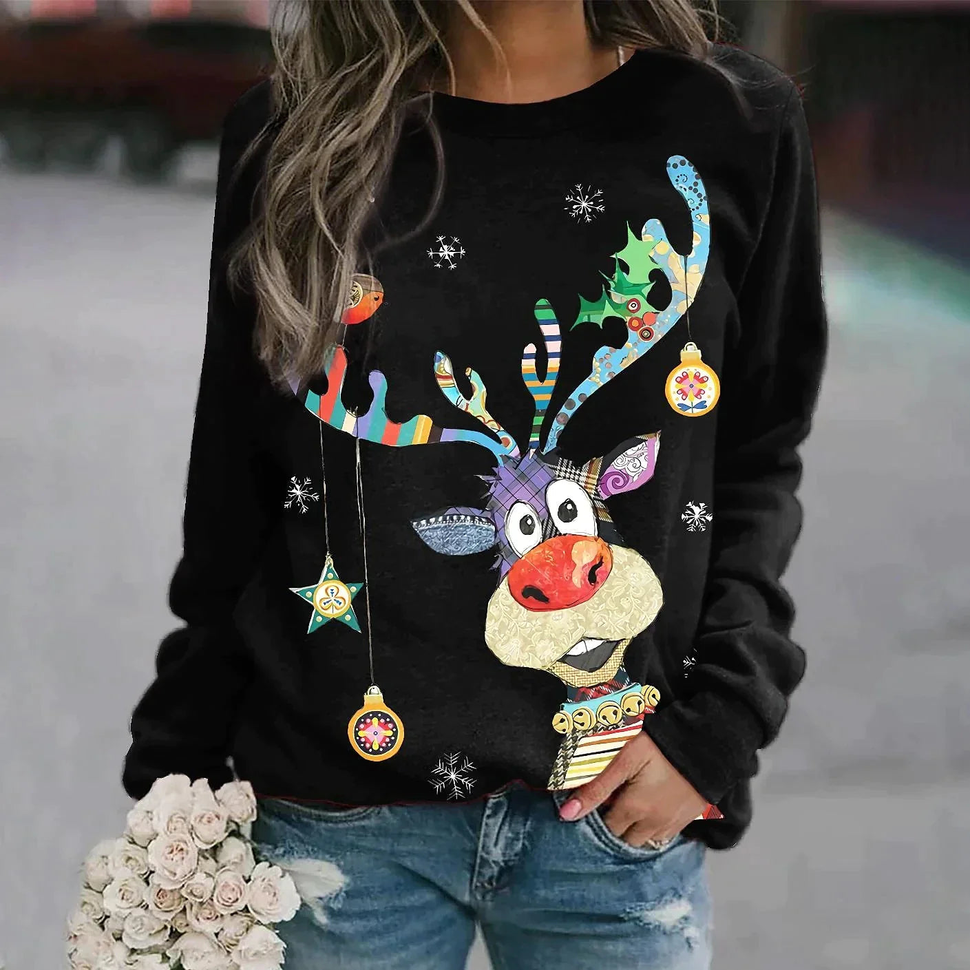 Black jumper with reindeer, baubles and small snowflakes.
