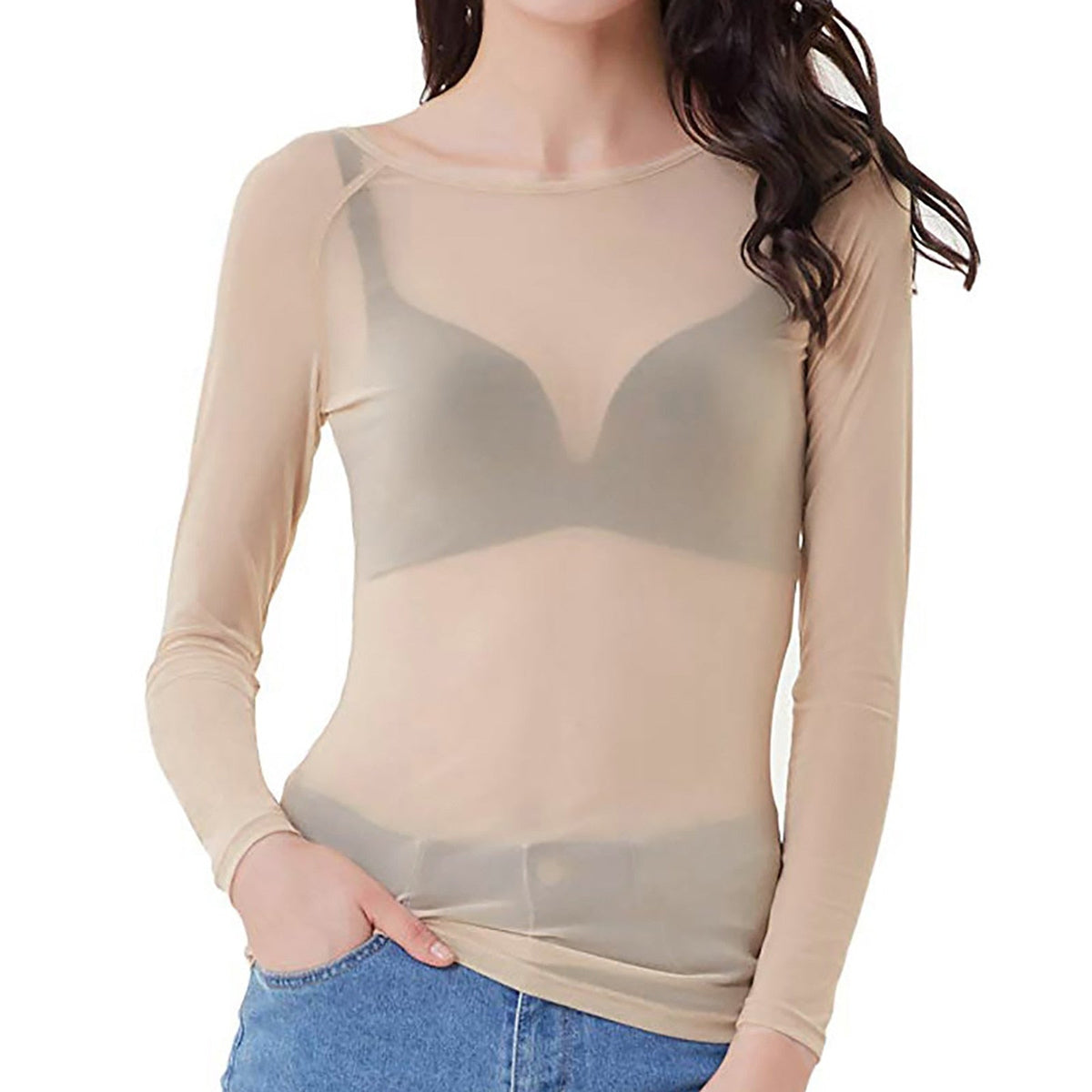 Cream sheer mesh top with long sleeves and a round neckline, worn with jeans.