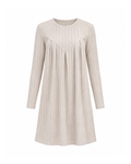 Beige ribbed knit shift dress with long sleeves, front view showing the pleated V yoke seam and crew neck