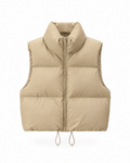 Khaki cropped puffer vest with a tall stand collar and a full-length zip, shown straight on against a white background
