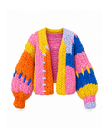 Multicolour chunky knit cardigan shown open from the front, with pink, yellow, orange, blue and lilac colour blocks and balloon sleeves