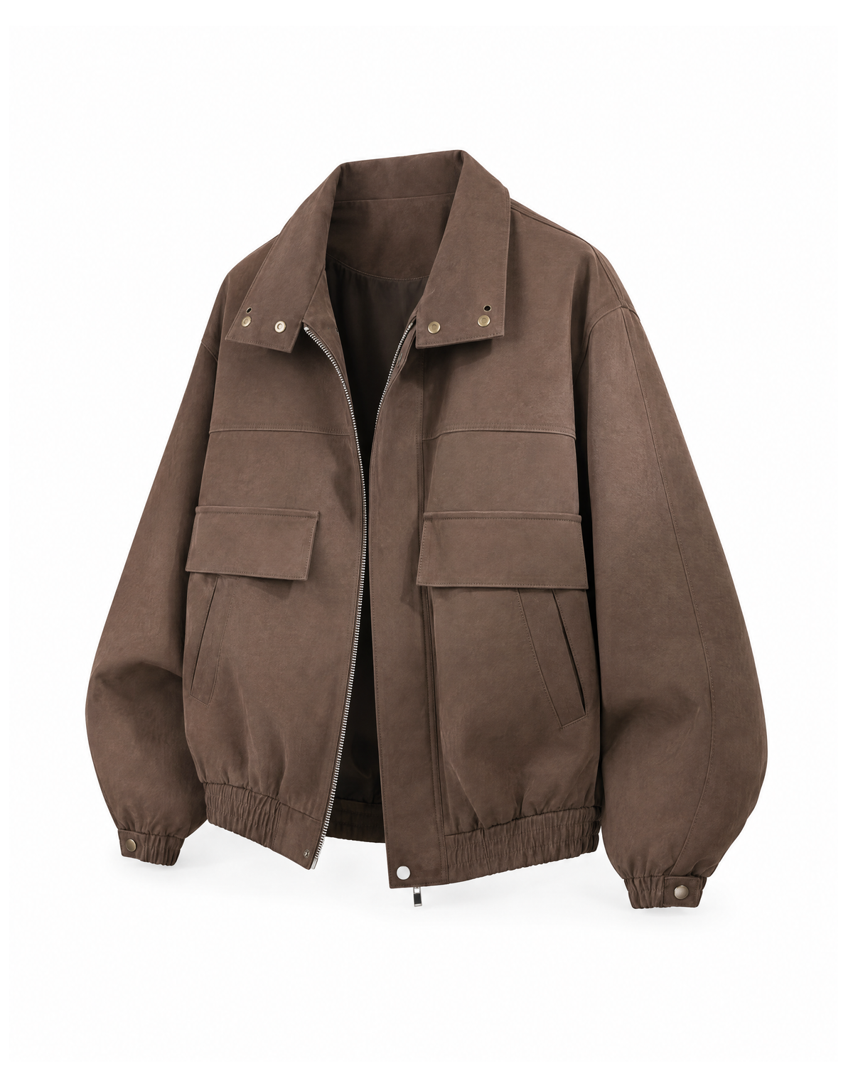 Three-quarter front view of the Brown oversized jacket showing the flap and welt pockets, elasticated cuff and gathered hem