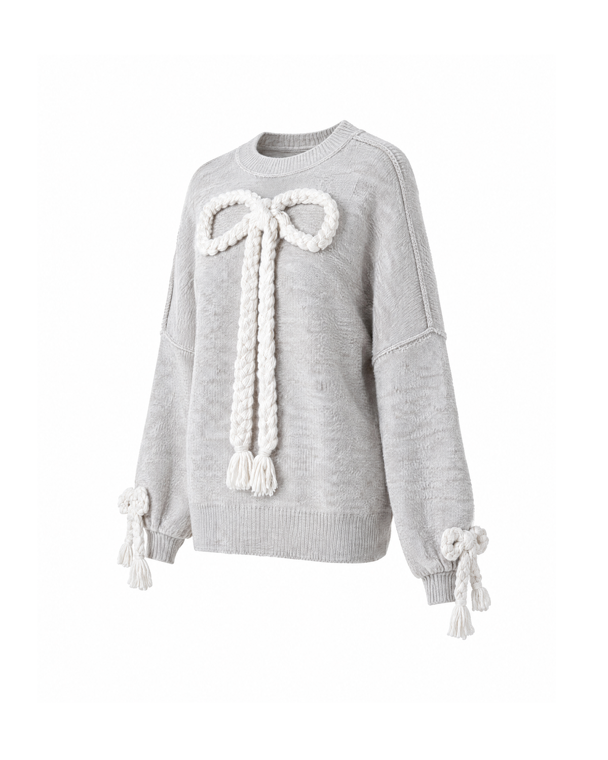 Grey braided bow knit sweater, three-quarter view on white, showing the cream braided front bow, the exposed shoulder seam and the bow-tied cuffs