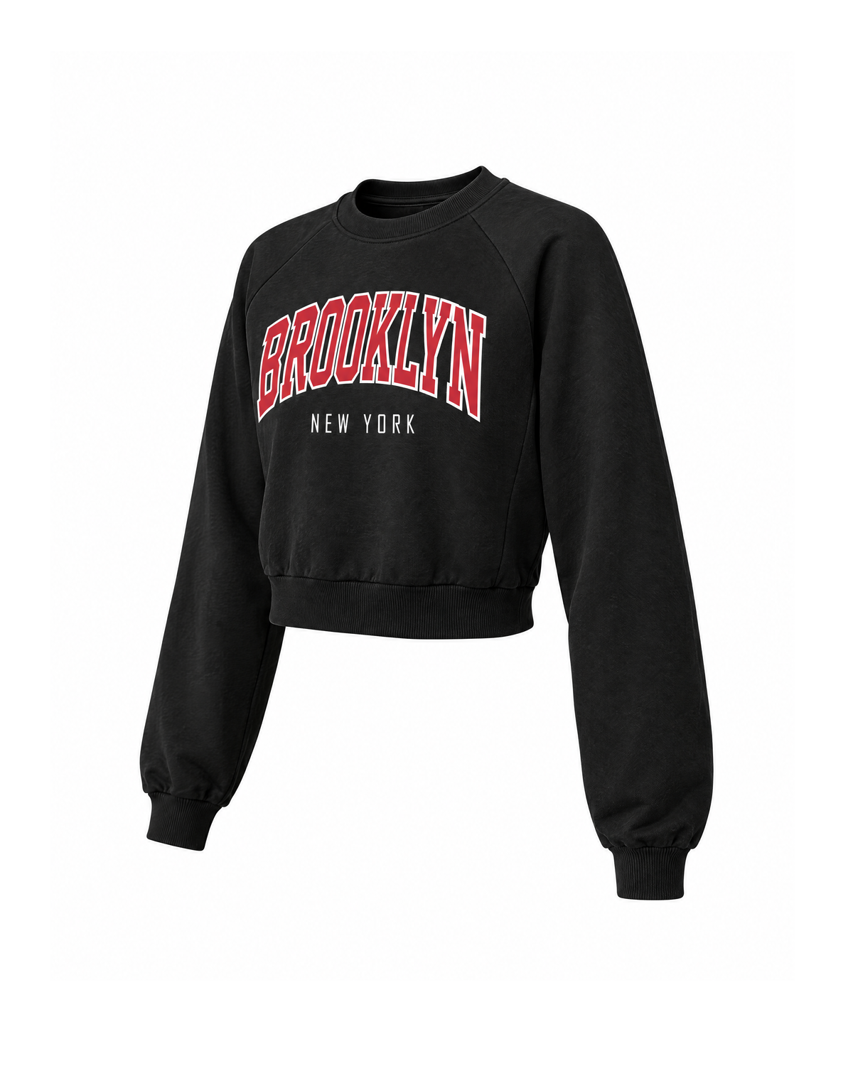 Cropped Brooklyn graphic sweatshirt in Black, three-quarter view showing the raglan seam, full sleeve and cropped ribbed hem