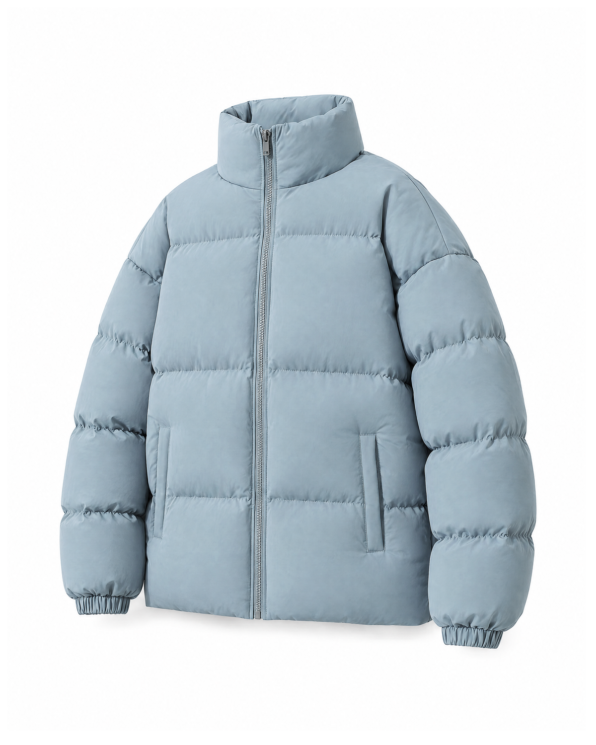 Light Blue quilted puffer jacket at a three-quarter angle on white, showing the depth of the padding, the elasticated cuffs and the straight hem